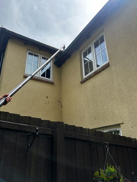 pole up to gutter on house, windows, fence